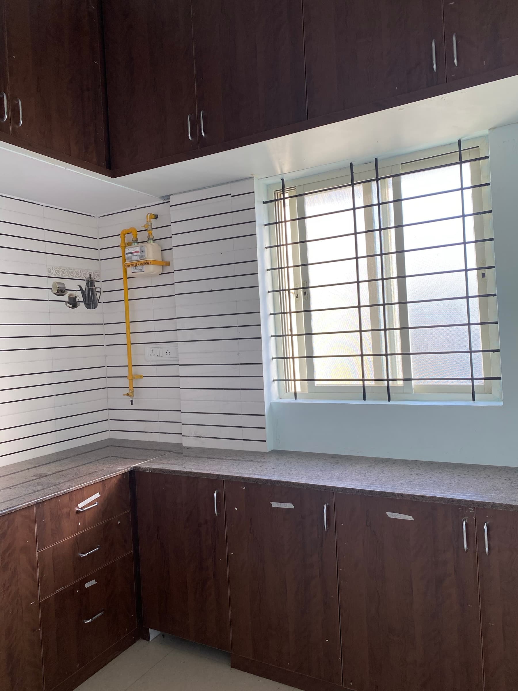 Geeta Ram Residency — kitchen window piped gas
