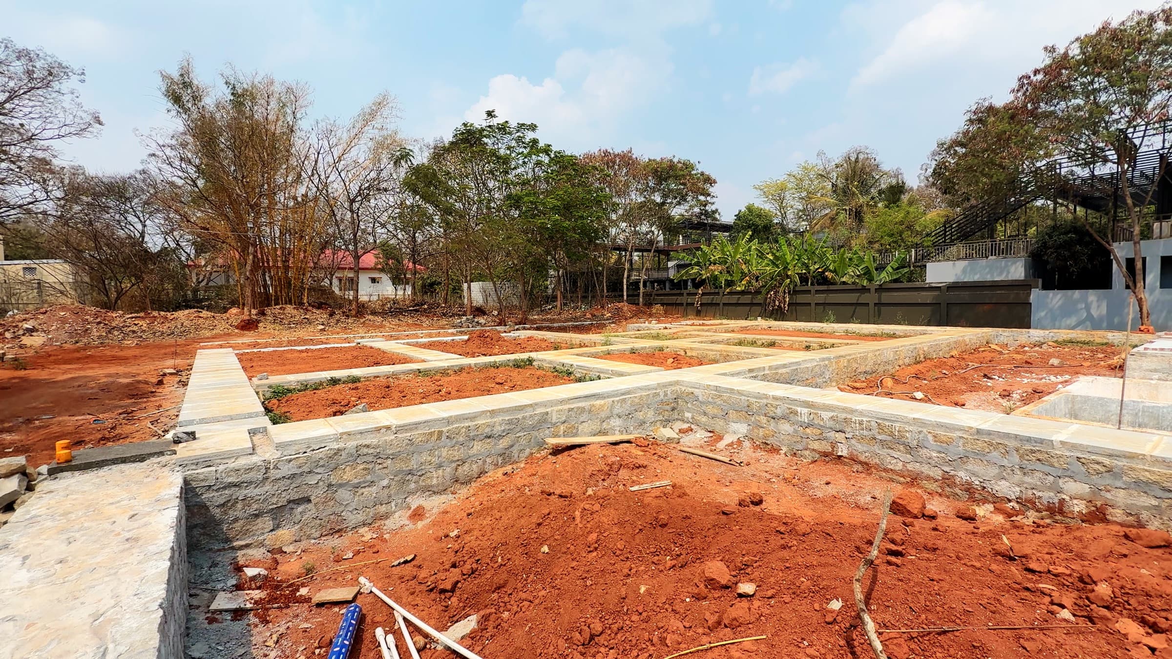 Jain Farms — stone plinth wide